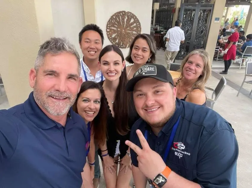 Team Legacy agents smiling together at an event